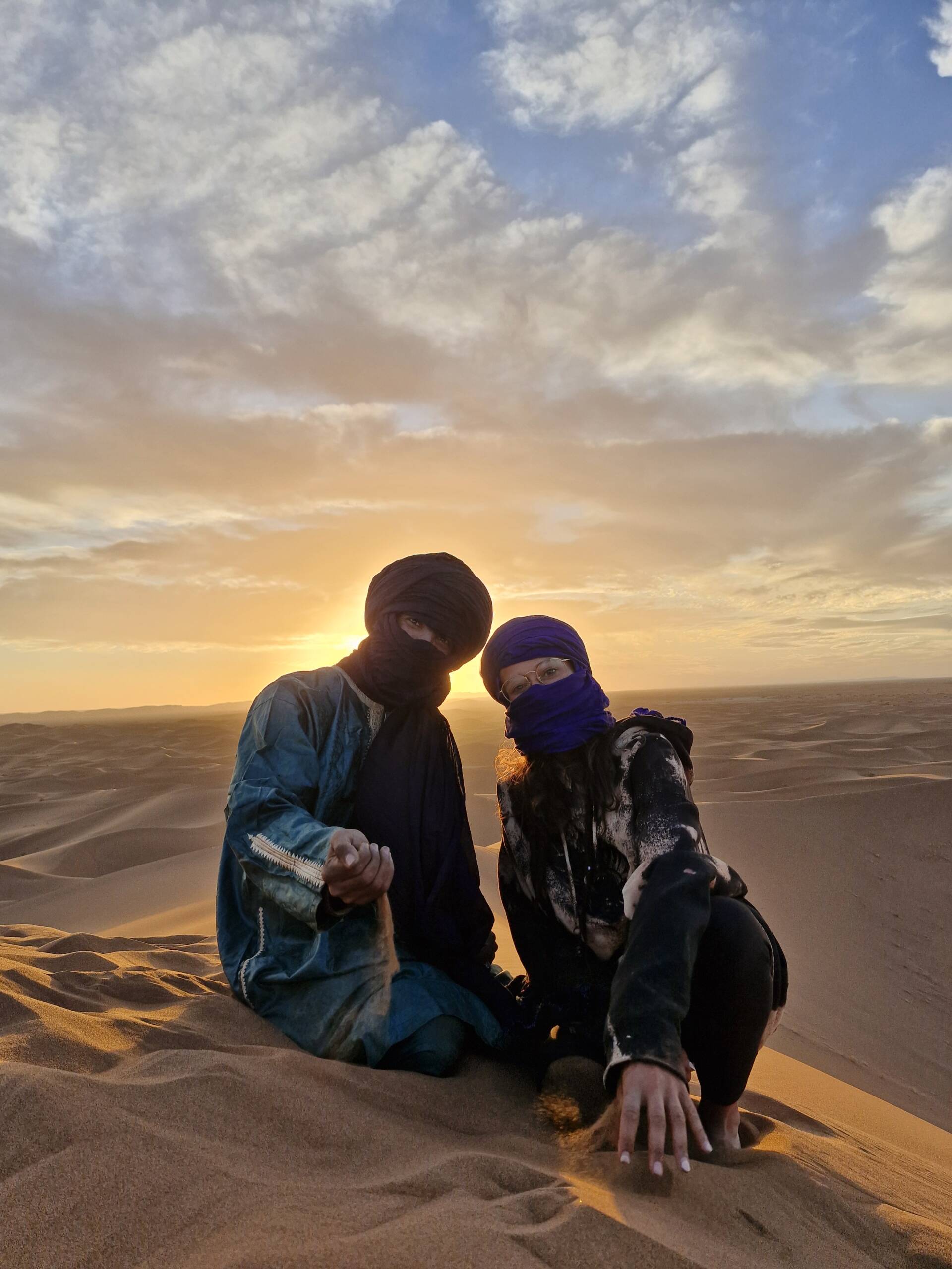 Sunrise yoga in Sahara Desert dunes